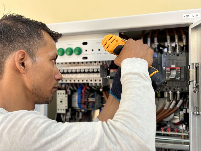 Tones electrician working on a switchboard