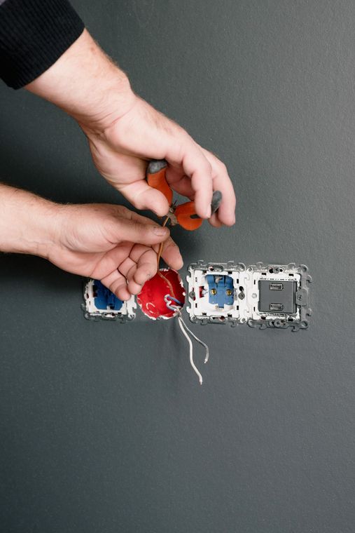 Electrician wiring a power point